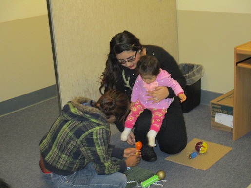 Playing with sound makers at the Christmas party